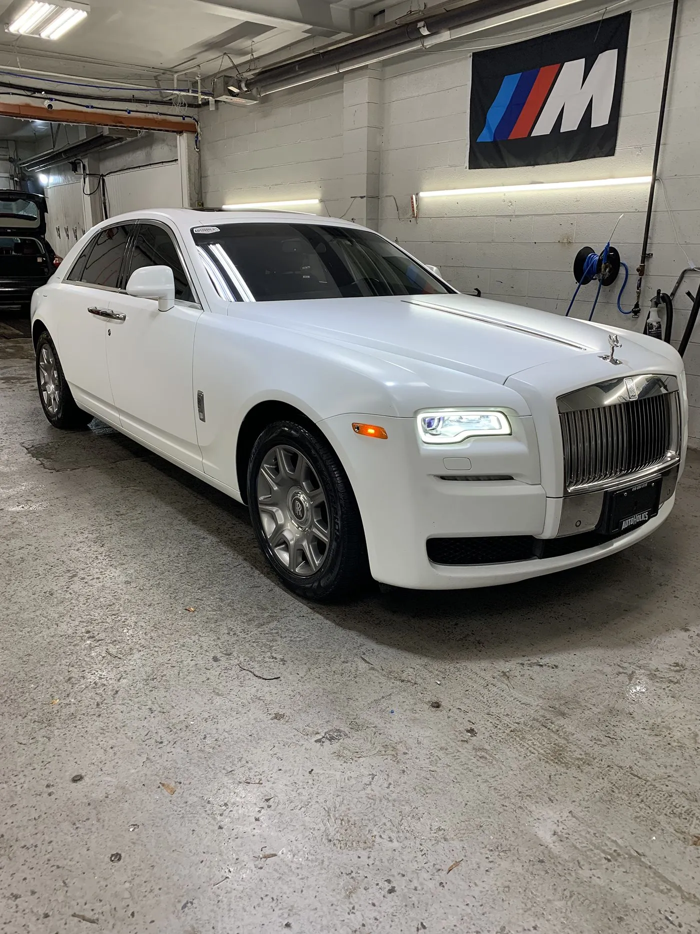 White Rolls-Royce Ghost after a hand wash