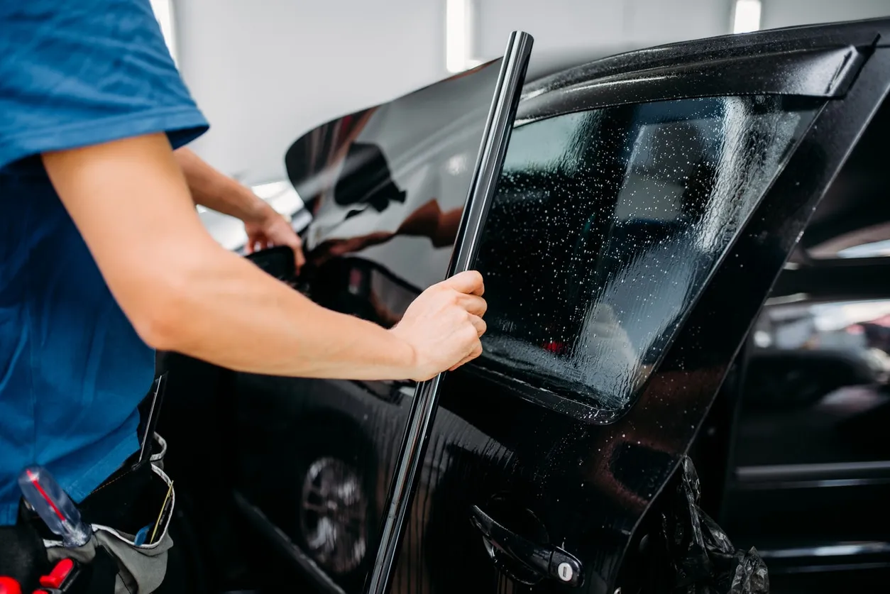 Applying window tint film to a car window